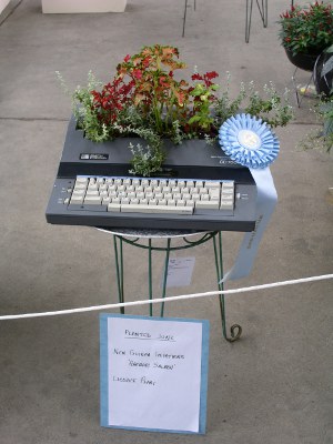 [Plant placed in the keystroke area of an electric typewriter.]